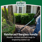 Shovel being used in a garden bed with overlay text about reinforced fiberglass handle and Expert Gardener logo