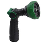 Side view of a black and green multi-pattern garden hose nozzle with ergonomic ribbed handle