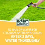 Hand-held hose spraying water over lawn with Expert Gardener logo and watering instruction text