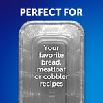 Top-down view of an empty aluminum loaf pan on gradient blue background with text suggesting uses like bread or meatloaf