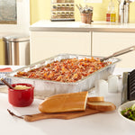 EZ Foil full-size aluminum pan on a kitchen counter filled with baked pasta and a serving spatula