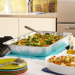 EZ Foil full-size aluminum pan on a kitchen counter filled with mixed vegetables and a serving spoon