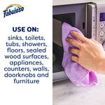 Close-up of hand wiping a microwave with a purple cloth next to text listing surfaces to use on and Fabuloso logo at top left.