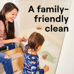 Parent and child at a bathtub with text 'A family-friendly clean' overlaid on the bathroom lifestyle scene
