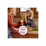 Lifestyle image of a parent and child at a kitchen counter with flowers and a plug-in warmer visible in the background, circular badge reading Garden Freshness