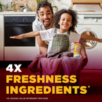 Smiling adult and child with laundry basket and Arm & Hammer scent booster in laundry room