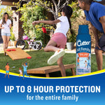 Outdoor lifestyle scene showing family playing cornhole with a Cutter All Family aerosol can prominently placed at right.