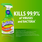 Fantastik green spray bottle on a green background with bold text 'Kills 99.9% of viruses and bacteria' and product details