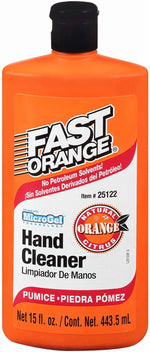 Close-up front label of an orange Fast Orange hand cleaner bottle with black cap and pumice callouts