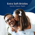 Promotional image of a smiling father and daughter with text proclaiming extra soft bristles to gently clean teeth.