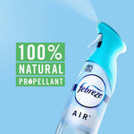 Febreze Air bottle angled on blue background with a green panel reading “100% NATURAL PROPELLANT”
