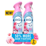 Two pink-capped Febreze Air Mist bottles with Downy floral graphics and a banner advertising 50% more odor fighters