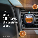 Febreze AUTO vent clip attached to car air vent shown with text claiming up to 40 days of consistent scent and orange slice accents