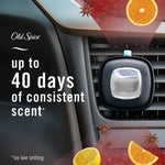 Febreze AUTO vent clip attached to a car vent with overlay text 'up to 40 days of consistent scent' and citrus/star anise accents