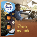 Lifestyle image combining Febreze Auto Evening Woods packaging art with a smiling driver in a car and the phrase 'refresh your ride'