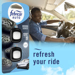 Lifestyle image combining Febreze AUTO Morning Shower packaging with a smiling driver in a car interior