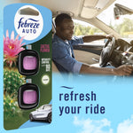Lifestyle image combining Febreze AUTO Cactus Flower twin pack packaging beside a smiling driver and text refresh your ride