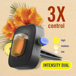 Close-up product render of a Febreze AUTO vent clip with intensity dial graphic and floral tropical accents