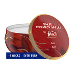 Red decorative tin candle with lid reading Baked Cinnamon Apples by Febreze, three visible wicks
