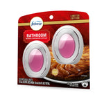 febreze bathroom air freshener two-pack in baked cinnamon apples scent with two oval pink gel devices on red limited edition package