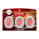 Packaged Febreze Bathroom oval air freshener devices on red baked cinnamon apples themed backing, three devices visible