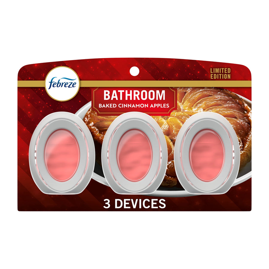 Packaged Febreze Bathroom oval air freshener devices on red baked cinnamon apples themed backing, three devices visible