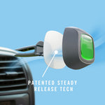 close-up of a febreze car vent clip with green gel and a white pad near a car air vent, with text reading patented steady release tech