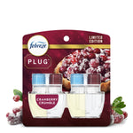 Febreze Plug refill twin pack with cranberry crumble packaging and sugared cranberries