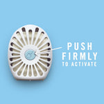 Single oval Febreze disposable device on blue background with arrow and text instructing to ‘PUSH FIRMLY TO ACTIVATE’