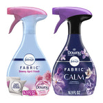 Two Febreze fabric refresher spray bottles side-by-side: Downy April Fresh and Downy Calm packaging.