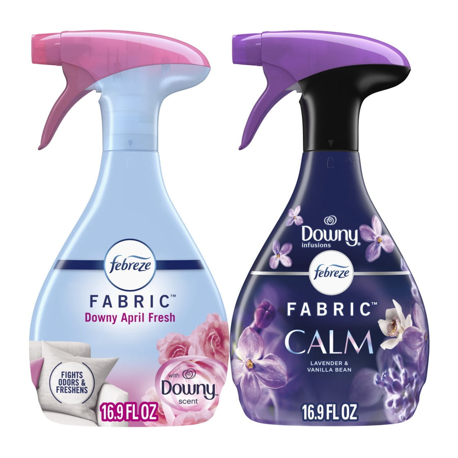 Two Febreze fabric refresher spray bottles side-by-side: Downy April Fresh and Downy Calm packaging.