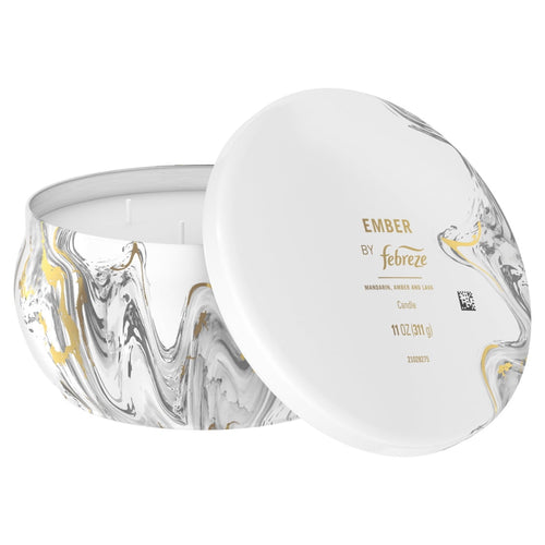 Febreze Ember candle with lid angled to show product label and marbled tin design on white background