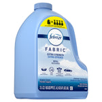 Angled front view of a blue Febreze Fabric Extra Strength refill jug showing label and usage icons