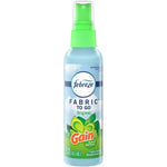 Single Febreze Fabric To Go spray bottle with green cap and Gain logo on the label against a white background.
