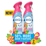 Two pink-capped Febreze Air Mist bottles with Gain Island Fresh branding and floral accents, 2-pack promotional graphic.