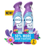 Two Febreze Air Mist spray bottles in purple-capped Gain Moonlight Breeze packaging with floral graphics and promotional badge.