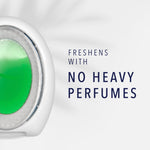 Close-up of a Febreze Light oval air freshener device with green gel and text reading ‘No heavy perfumes’