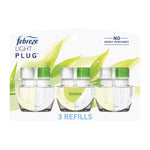 Three Febreze Light Plug refill bottles in clear plastic blister pack with green bamboo graphics