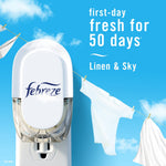Febreze plug device with clothesline and text claiming ‘first-day fresh for 50 days’ Linen & Sky