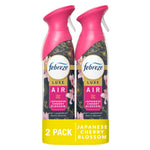 Two Febreze Luxe Air Japanese Cherry Blossom spray bottles with pink nozzles shown side by side in retail pack.