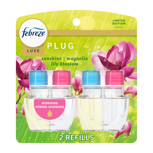 Febreze Luxe plug-in oil refill twin pack on green floral backing labeled Morning Spring Showers.