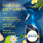 Close-up of a Febreze Luxe Ocean spray bottle with text highlighting freshness benefits on a blue textured background