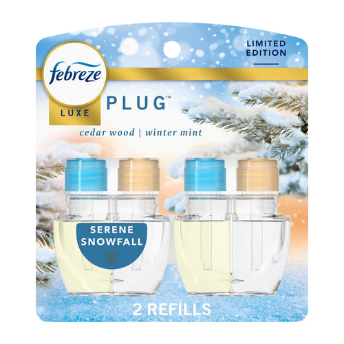 Febreze Luxe plug-in refill twin pack in winter-themed Serene Snowfall packaging showing two clear oil refills