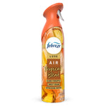 Febreze Luxe Air Mist bottle in tropical-orange packaging labeled 'Tropical Blend' with pineapple imagery.