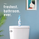 Febreze Air Mist bottle placed on a toilet tank in a styled bathroom with headline text 'freshest. bathroom. ever.'