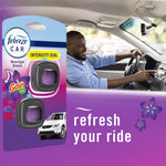 Lifestyle composite showing Febreze Car Moonlight Breeze 3-clip pack at left and smiling driver in a car interior at right