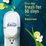 Febreze plug-in shown in outlet on teal background with text 'first-day fresh for 50 days' and rainforest scent accents.