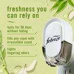 Febreze plug-in device close-up with text listing benefits on a green bamboo-themed background