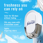 Close-up of a Febreze plug-in device against blue sky background with product benefits text