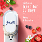 Febreze plug-in device shown with scattered berries on a pink background and text stating 'first-day fresh for 50 days' and 'Berry & Bramble'